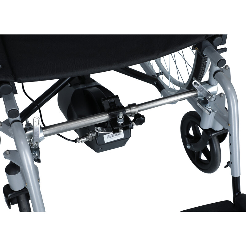 Elektrický prídavný pohon k invalidnému vozíku určený pre doprovod